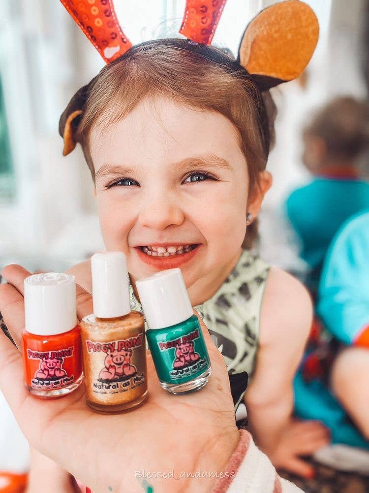  Christmas Cutie Nail Set featuring two festive, non-toxic nail polish colors, a gentle nail polish remover, and holiday-themed nail art, perfect for kids and safe for use during pregnancy. Vegan, cruelty-free, and made in the USA.