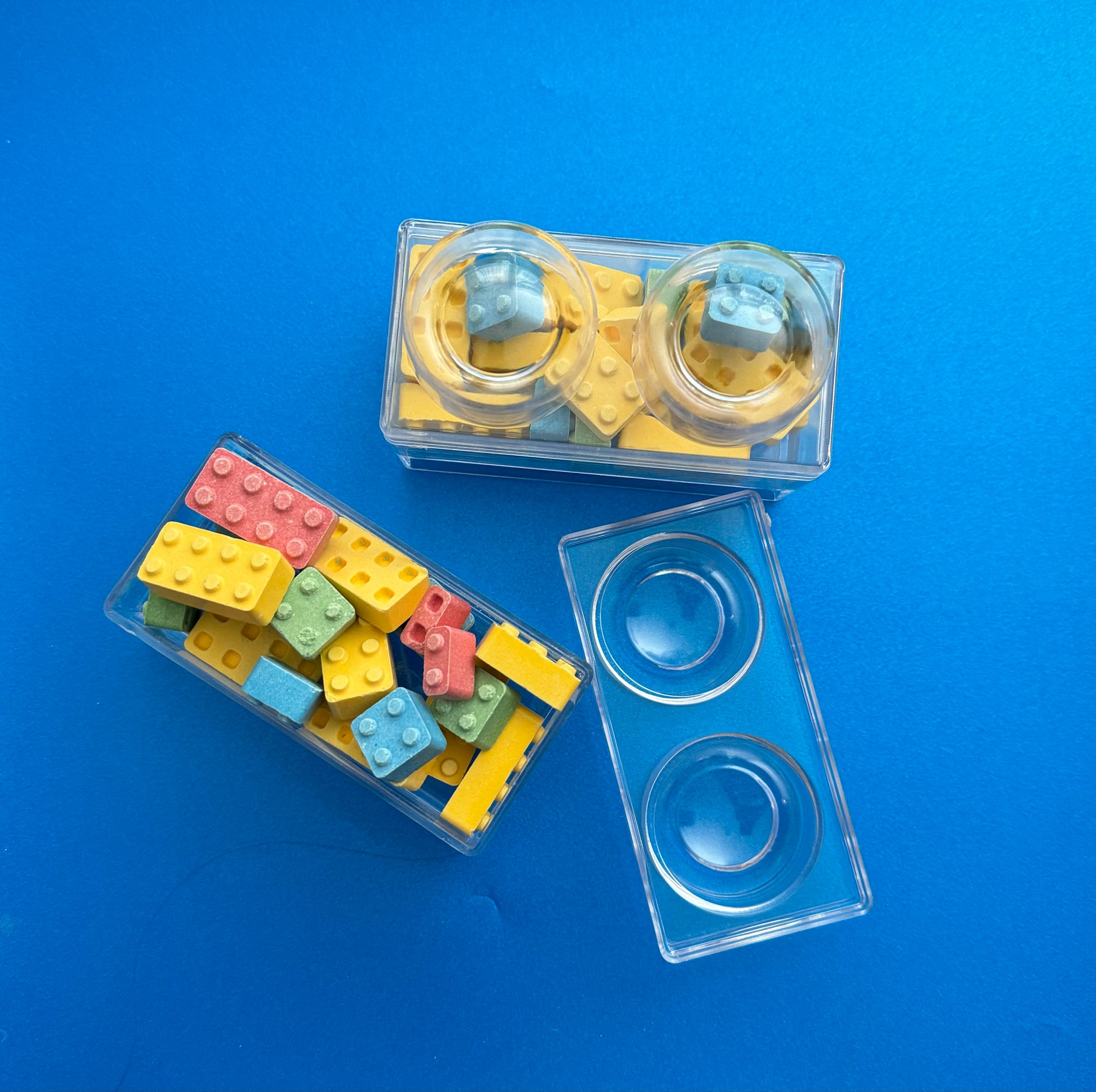 Block-themed candy favor in a brick-shaped box, perfect for birthday parties or playdates. Includes Lego-themed candies with optional cellophane wrap and thank you label. Custom candy containers available upon request.