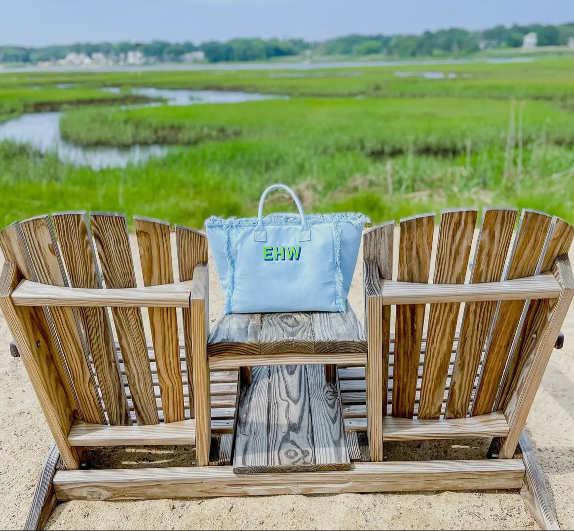 Stylish On the Fringe Tote featuring playful fringe detailing for a fun, fashionable look. Made with high-quality materials, this tote is perfect for spring break, adding a trendy touch to any outfit