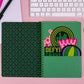 Wicked-inspired mini notebook with 160 college-ruled pages, durable hardcover, and convenient pockets.