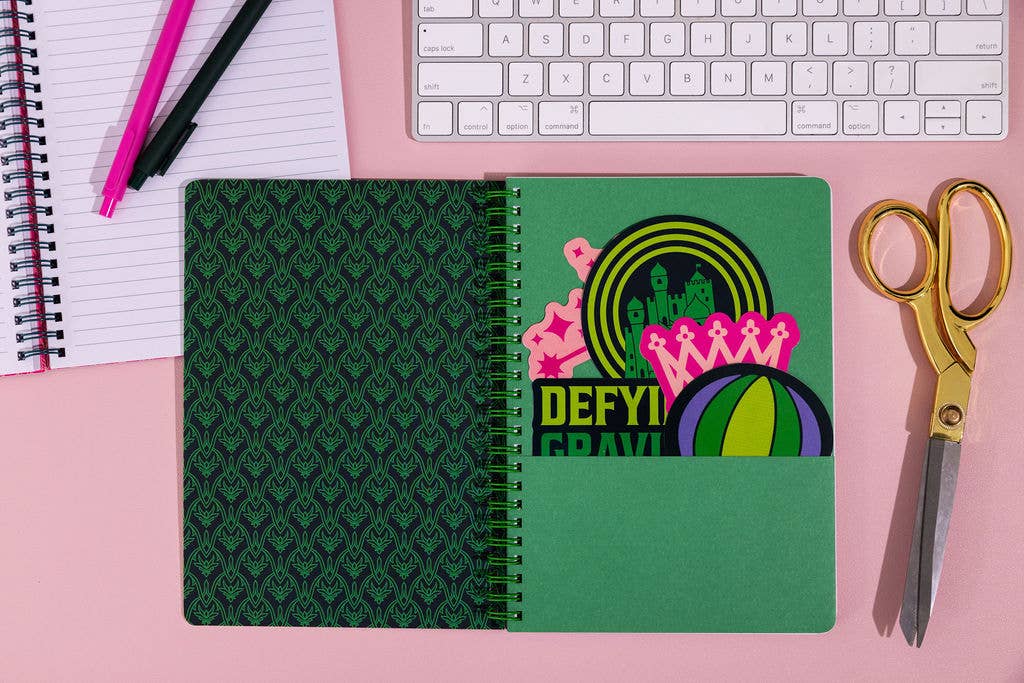 Wicked-inspired mini notebook with 160 college-ruled pages, durable hardcover, and convenient pockets.