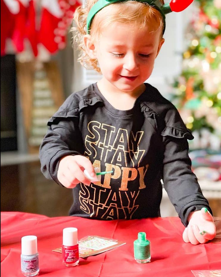  Christmas Cutie Nail Set featuring two festive, non-toxic nail polish colors, a gentle nail polish remover, and holiday-themed nail art, perfect for kids and safe for use during pregnancy. Vegan, cruelty-free, and made in the USA.