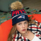 Hand-knit New England Patriots beanie made of 100% merino wool, with 'Pats' stitching and team logo.