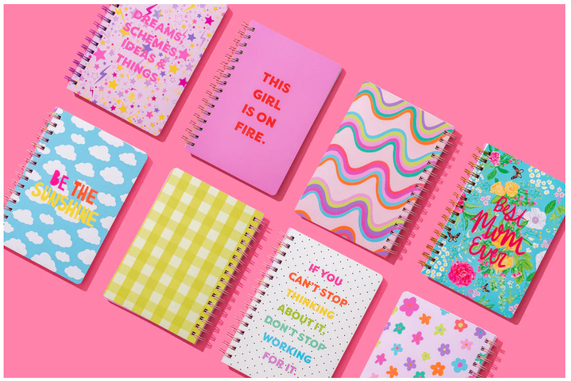 6.5" x 8.5" "Best Mom Ever" notebook with 200 lined pages, gold spiral binding, and a hot pink raised imprint on the hard cover. Perfect gift for moms, featuring perforated pages for easy tearing.