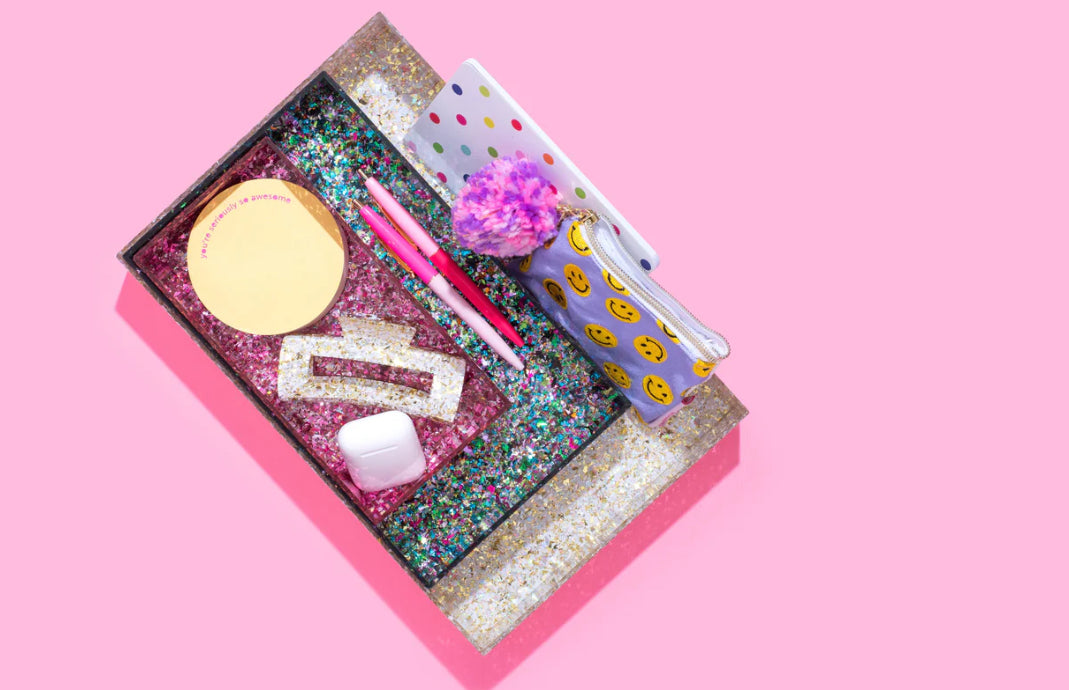 Add sparkle to your home or office with this 12x8 acrylic confetti tray, featuring a 2-inch height and pearl confetti mix. Perfect for guest bathrooms, coffee tables, or as a stylish desk tray. Elevate your decor with this imported, elegant accessory