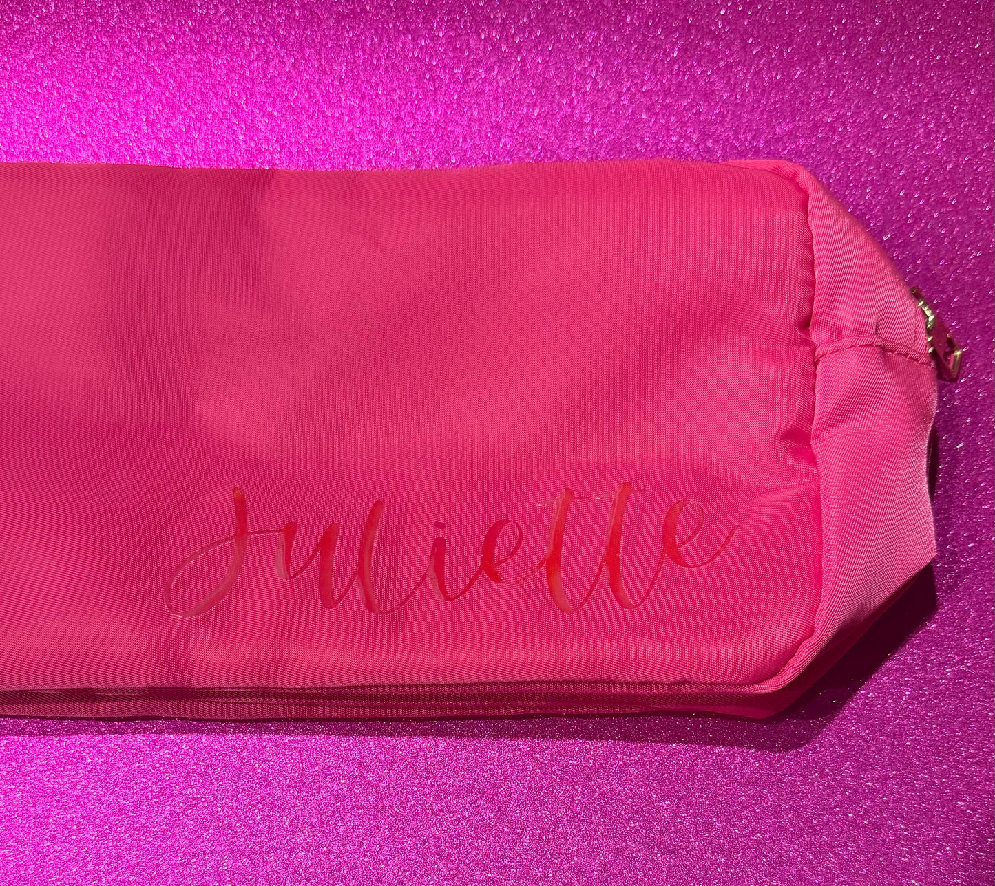 Personalized cosmetic pouch with zipper, featuring custom name, initials, or trendy icons. Lightweight and durable, available in neon or neutral colors with gold zippers. Size: 10" long x 5" wide x 3" deep. Perfect for summer slumber parties, travel, school, or as a makeup organizer. Great gift for girls, bridesmaids, or team members.