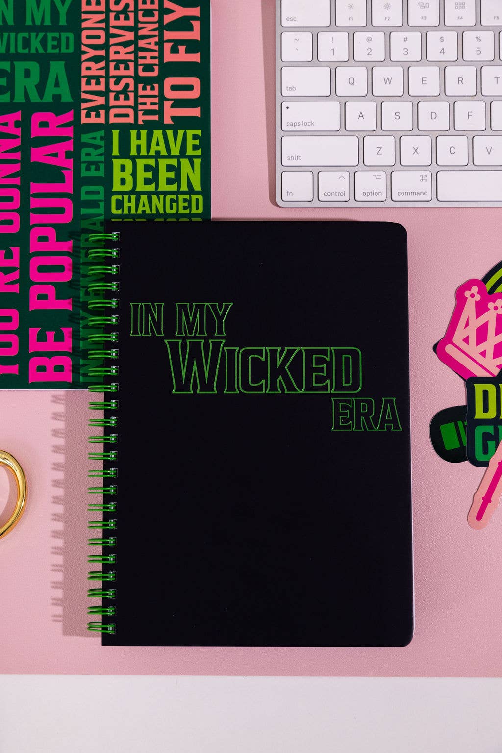 Wicked-inspired mini notebook with 160 college-ruled pages, durable hardcover, and convenient pockets.