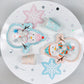 Pack of 12 snowman-themed paper plates, perfect for winter parties and snow day celebrations. Frosty design adds a fun touch to holiday gatherings. Not microwave safe, ideal for festive table settings.