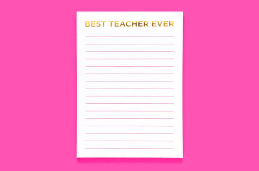 5x7 "Best Teacher Ever" notepad with 50 lined sheets and shiny gold foil on each page. Features a magnet on the back, perfect for teacher appreciation gifts. Comes in shrink-wrap packaging.