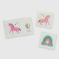 Unicorn and rainbow-themed temporary tattoos with candy-like colors, gold, and holographic silver foil. Illustrated by Hello!Lucky for Daydream Society. Pack includes 2 tattoos (1 of each design), each measuring 2.5 inches square. Safe, non-toxic, and packaged in a card stock envelope