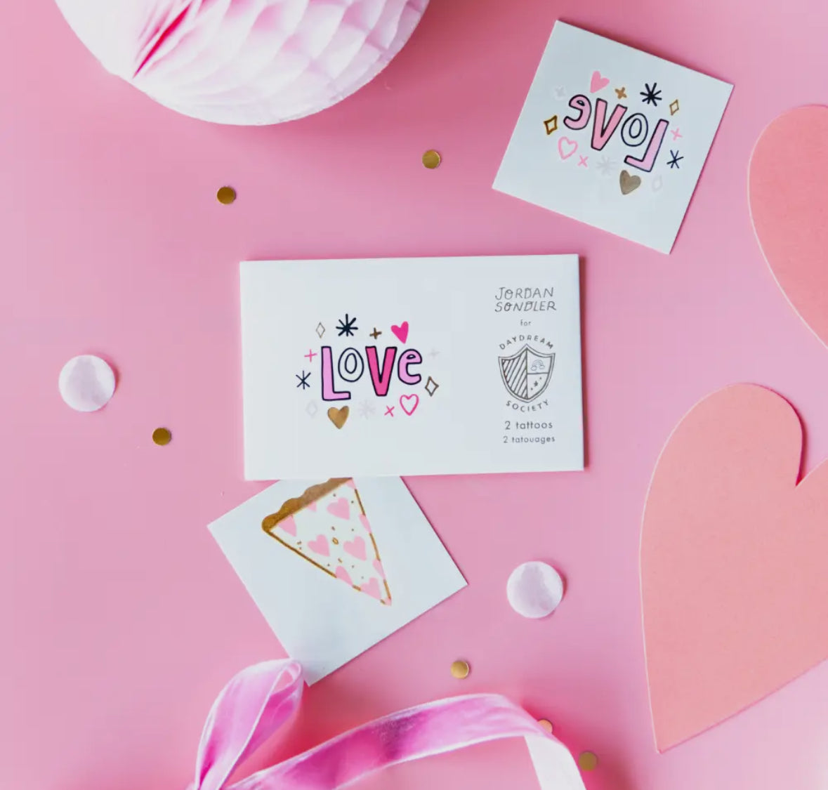 Valentine's Day temporary tattoos featuring neon colors and gold foil accents, illustrated by Jordan Sondler for Daydream Society. Package includes 2 safe, non-toxic tattoos, each measuring 2.5 inches square, packaged in a cardstock envelope. Perfect for party favors.