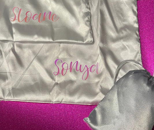 Personalized satin pillowcase made from soft microfiber fabric, perfect for reducing facial creases and wrinkles. Comes in a satin pouch for easy storage.