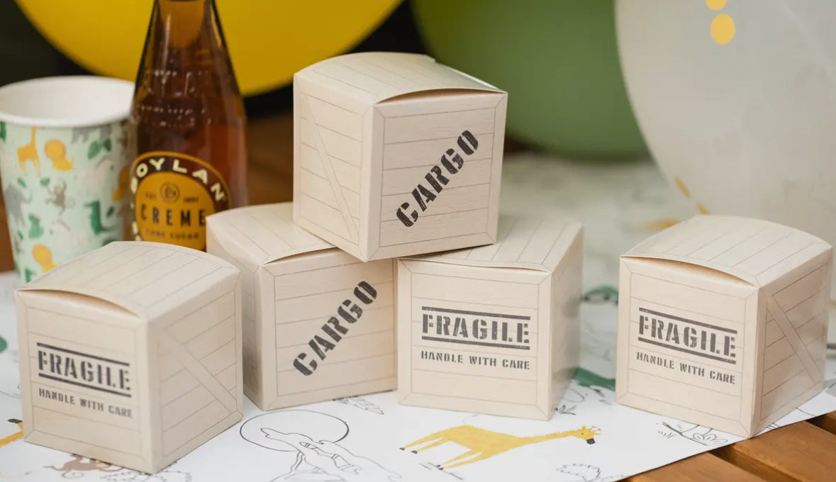 Safari-themed favor boxes designed to resemble cargo boxes, perfect for birthday party treats. Includes 8 closable boxes, each measuring 3 inches tall, wide, and deep. Add adventure to your celebrations with these fun and functional treat boxes.