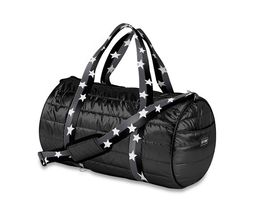 Classic puffer weekender bag in black with a decorative white star strap. This stylish bag measures 17" x 11" x 11", perfect for short trips or as a fashionable gym bag