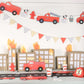 Bright red fire truck garland designed for kids' parties, featuring charming details and eco-friendly materials. Ideal for creating a fun atmosphere at fire-themed celebrations.