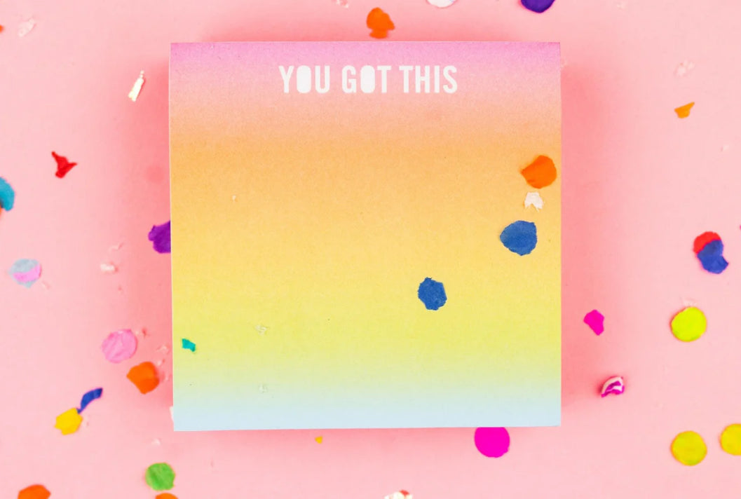 Colorful sticky notes measuring 3.5" x 3.5", featuring the inspirational phrase 'You Got This.' Each pad includes 300 sheets with a sticky adhesive backing, shrink-wrapped for packaging. Perfect for adding fun to your workday. 