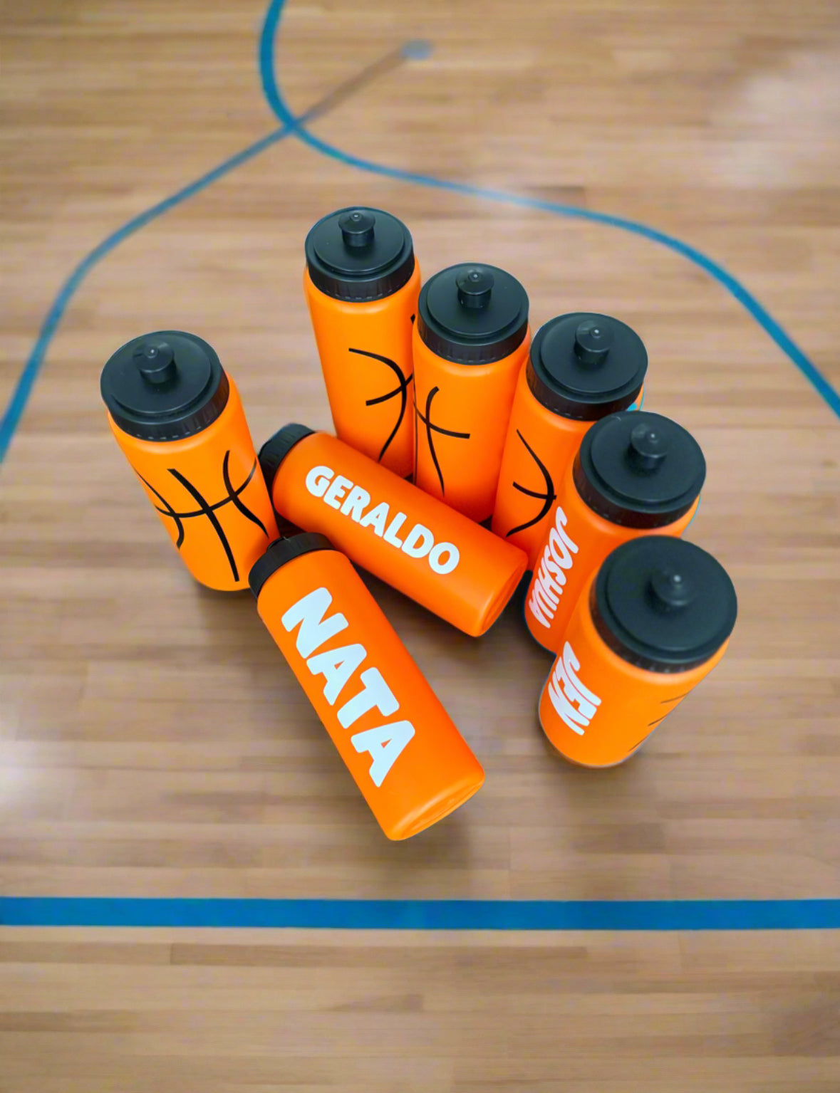 Custom sports water bottles for basketball, personalized with names. Features durable HDPE material, leak-proof pull-top cap, 20 oz capacity, and slim design. Ideal for sports events, school, and gifts. Available in custom colors and fonts.