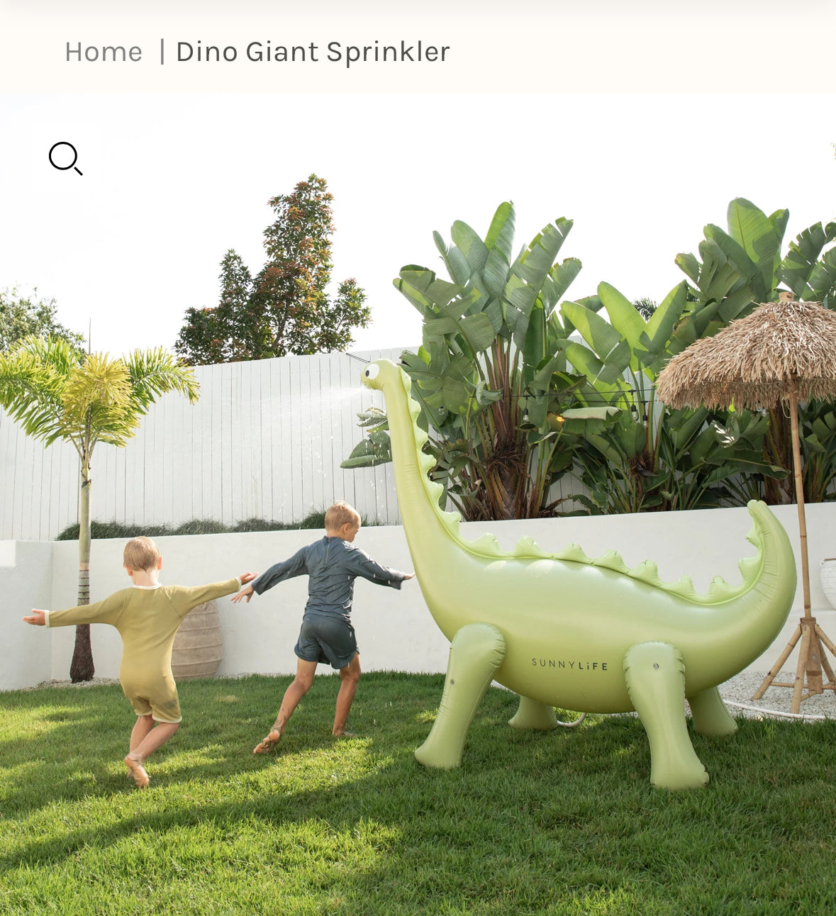 Into The Wild Dino Giant Sprinkler, standing over 6 feet tall. Attach to your garden hose for refreshing water play. Made from durable, non-toxic PVC. Perfect for kids' summer fun with lifelike 3D details. Includes hose adaptor and repair patch.