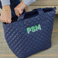 Personalized quilted tote combining practicality and style. Features a unique quilted design and customizable personalization, making it a one-of-a-kind accessory for any occasion. Stay organized and chic with this must-have tote