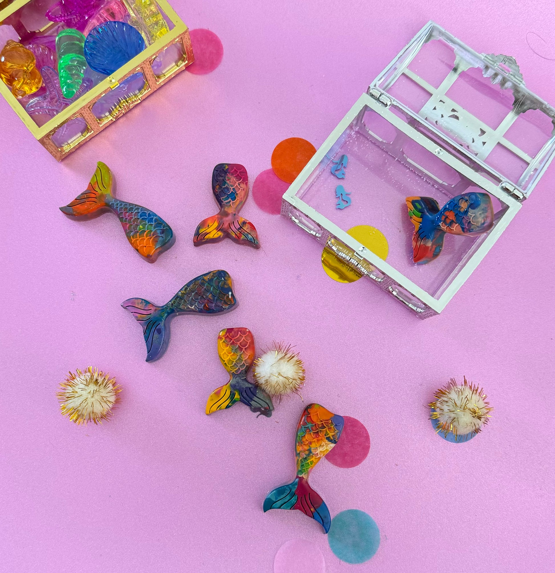 Mermaid tail-shaped crayons in a treasure chest gift box, perfect party favor for kids ages 3-8. Available in multicolor or solid colors, handmade in the USA with 100% non-toxic crayons. Great for school events, birthdays, or non-candy favors. Parental supervision advised due to small parts