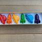 Awesome space-themed crayon gift set containing 6 non-toxic crayons in an 8" x 2" box. Perfect for stocking stuffers, Easter baskets, party favors, and classroom gifts. Made from recycled and upcycled materials, featuring assorted colors including red, green, blue, and more.