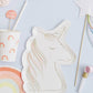 Unicorn-shaped party plates featuring shiny gold foil embellishments and neon print. Perfect for adding a magical touch to any fairytale-themed party. Set includes 8 high-quality plates, measuring 170mm x 230mm, ideal for dessert or snacks.