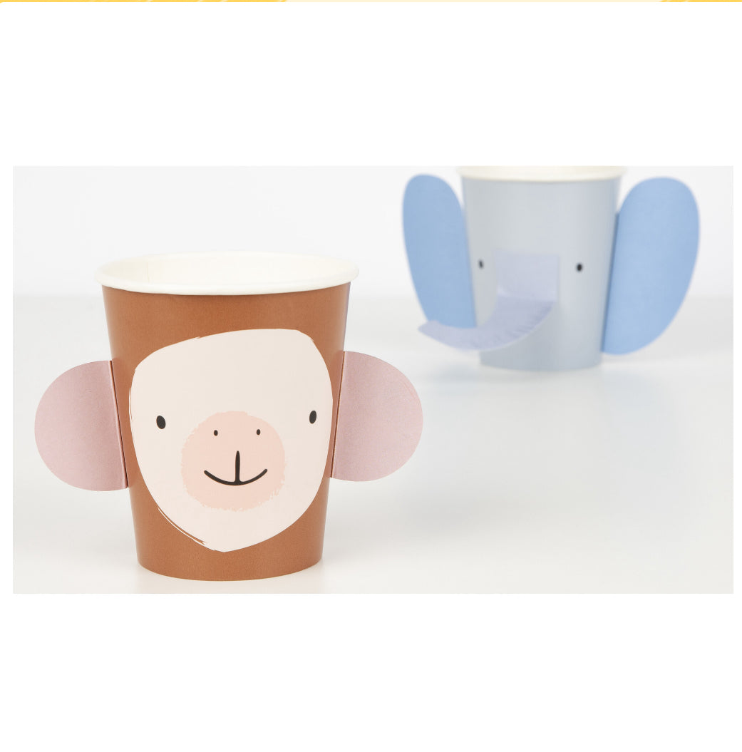 Colorful Animal Parade cups designed for children's parties, featuring fun embellishments. Each set includes four designs: monkey, elephant, crocodile, and lion. Suitable for hot or cold drinks, made from sustainable FSC paper. Pack contains 8 cups, each with a 9 oz capacity.