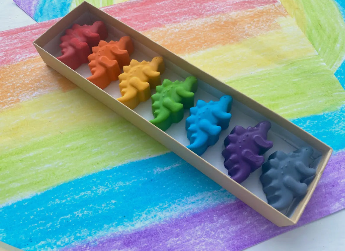 Eco-friendly dinosaur crayons gift set made from recycled materials, featuring 7 non-toxic crayons in assorted colors. Great for parties, holidays, and everyday fun!