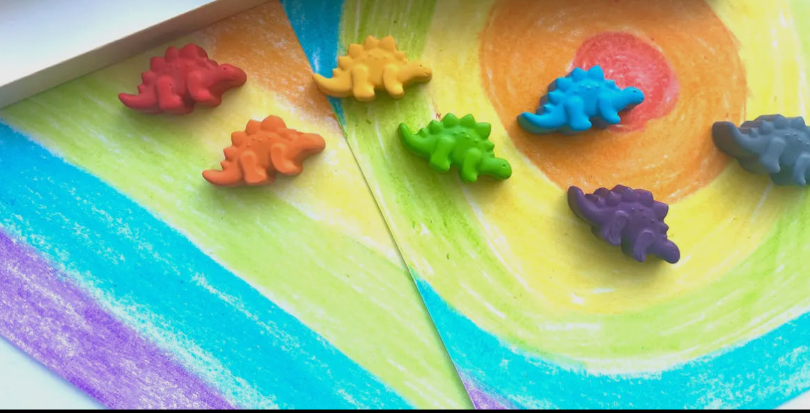 Eco-friendly dinosaur crayons gift set made from recycled materials, featuring 7 non-toxic crayons in assorted colors. Great for parties, holidays, and everyday fun!