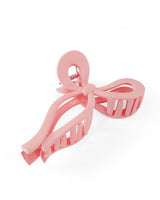 Jumbo bow claw clips in pink and white, trendy and stylish hair accessories for all hair types.