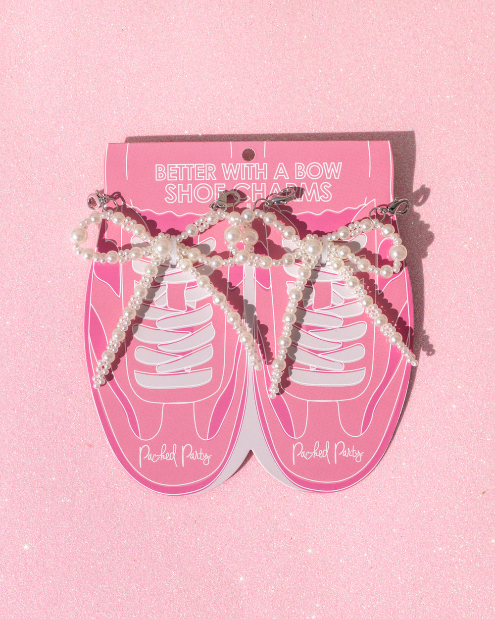 Better with a Bow shoe charms with pearl-studded bows, perfect for adding glam to sneakers and party shoes.