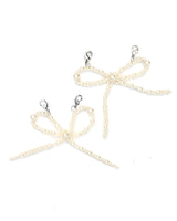 Better with a Bow shoe charms with pearl-studded bows, perfect for adding glam to sneakers and party shoes.