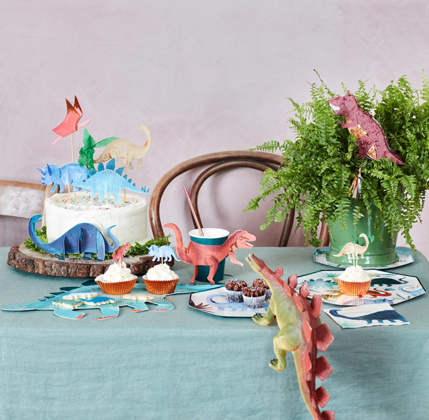 Dinosaur Cake Toppers Set with 5 Colorful Dinosaurs and a Crepe Paper Palm Tree, Perfect for Transforming a Birthday Cake into a Jurassic Feast.