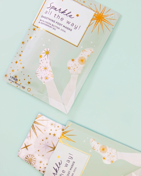 Holiday Sparkle All the Way Smoothing Foot Masks designed to hydrate and smooth dry, cracked feet, offering a festive foot care treatment for soft, silky skin, perfect for holiday self-care or gifting.