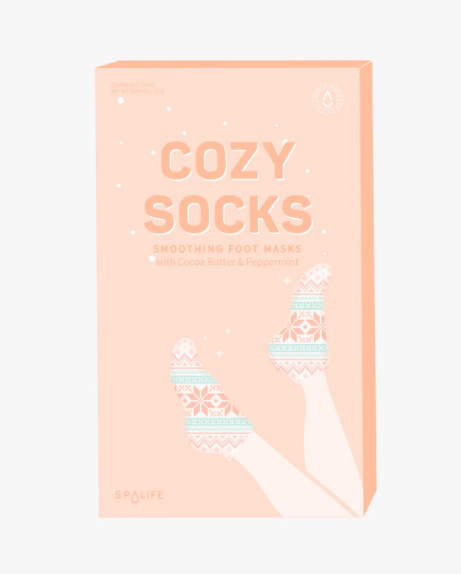 Cozy Socks Smoothing Foot Masks enriched with cocoa butter and peppermint oil, designed to hydrate and heal dry, cracked feet, featuring a fun fair isle print for a festive and relaxing self-care experience.