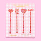 Colorful confetti stir sticks with Love, XO, Heart, and Lips designs, perfect for parties.