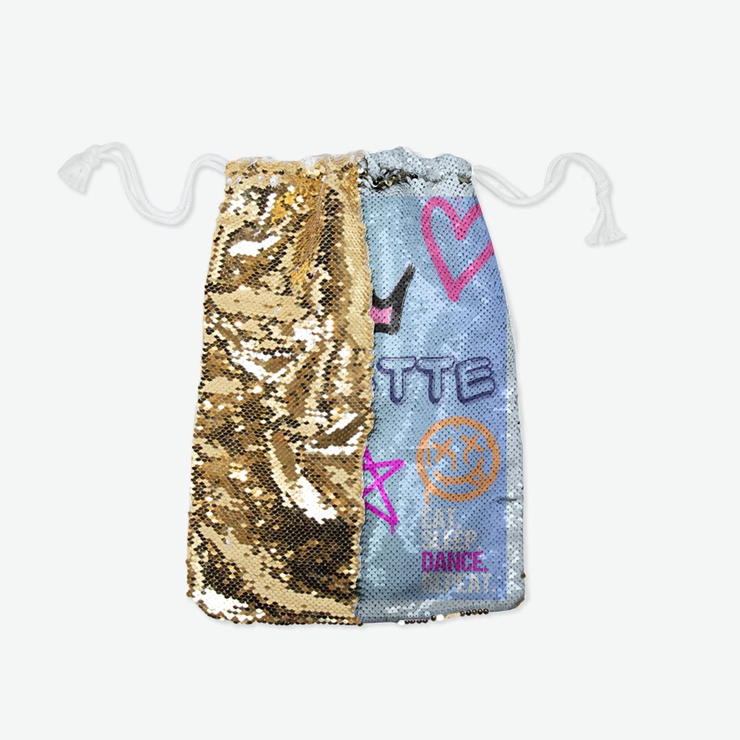 Stylish reversible sequin pull string bag in gold, rose gold, and silver, measuring 11.5"W x 16.25"H. Features a front of swipable two-tone sequins, a back of white cotton/polyester blend, and black lining inside. Customizable with fonts, images, brands, or logos, perfect for unique bunk decor.