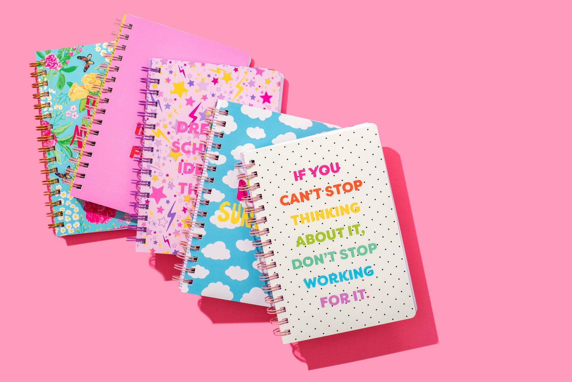 Hardcover notebook with motivational phrase, stars pattern, perforated pages, purple binding.