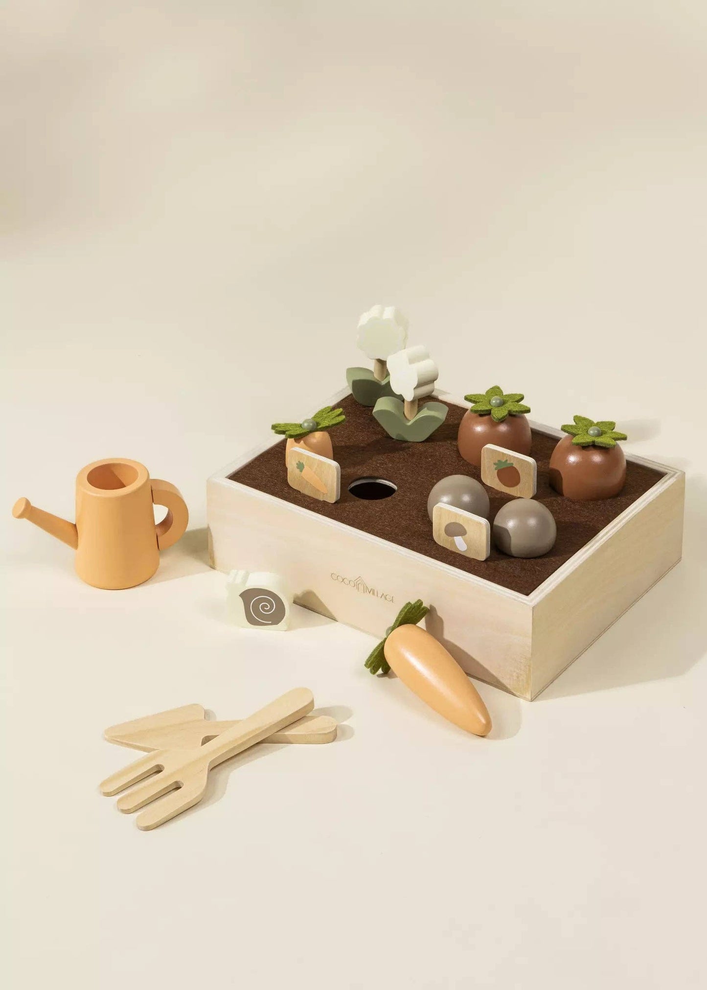 Wooden Garden Playset for kids with flowers, carrots, tomatoes, mushrooms, snail, gardening tools, watering can, and garden signs. Perfect for nature-inspired imaginative play, helping children learn about gardening while developing motor and social skills in a fun way.