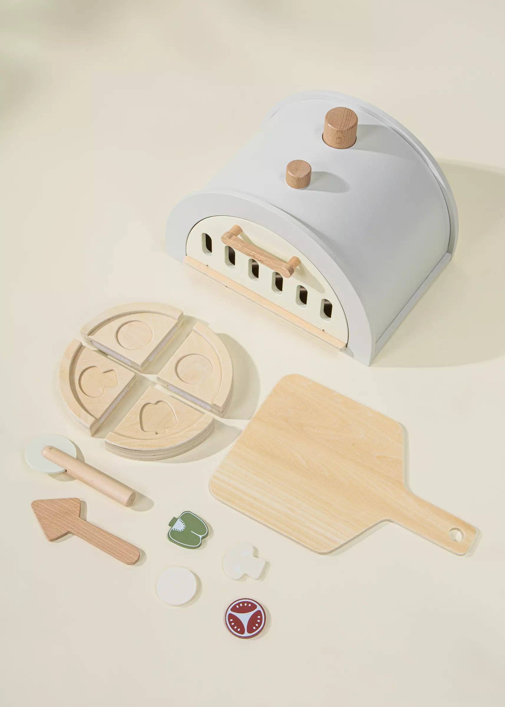 Wooden Pizza Oven Playset for kids with oven, 4 pizza slices, tomato, onion, mushroom, green pepper, pizza peel, cutter, and pie server. Ideal for pretend play, sparking creativity, and hosting pizza parties where little chefs can bake and share their creations.