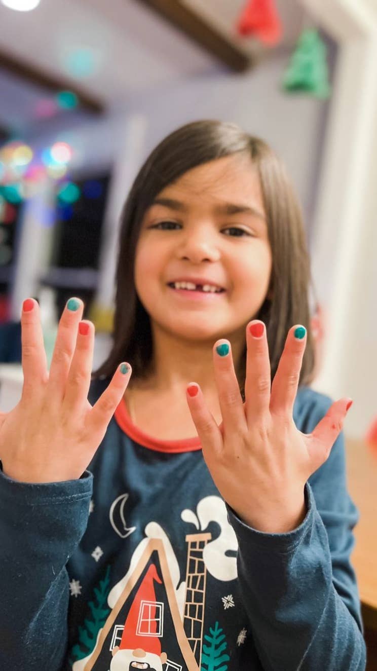  Christmas Cutie Nail Set featuring two festive, non-toxic nail polish colors, a gentle nail polish remover, and holiday-themed nail art, perfect for kids and safe for use during pregnancy. Vegan, cruelty-free, and made in the USA.