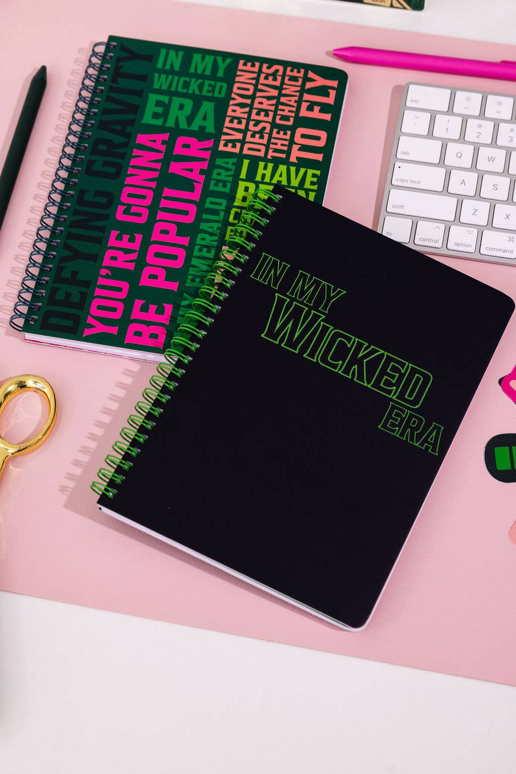 Wicked-inspired mini notebook with 160 college-ruled pages, durable hardcover, and convenient pockets.