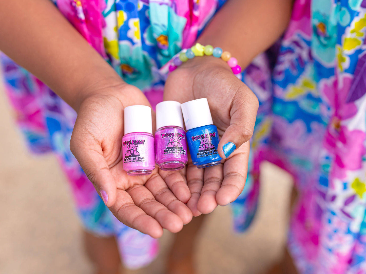 Piggy Paint Mermaid in the Shade Nail Set featuring three non-toxic, vibrant polishes (Mermaid in the Shade, Tickled Pink, Let’s Jam) and flower-themed nail art. Safe for kids and pregnancy, cruelty-free, and vegan-friendly.