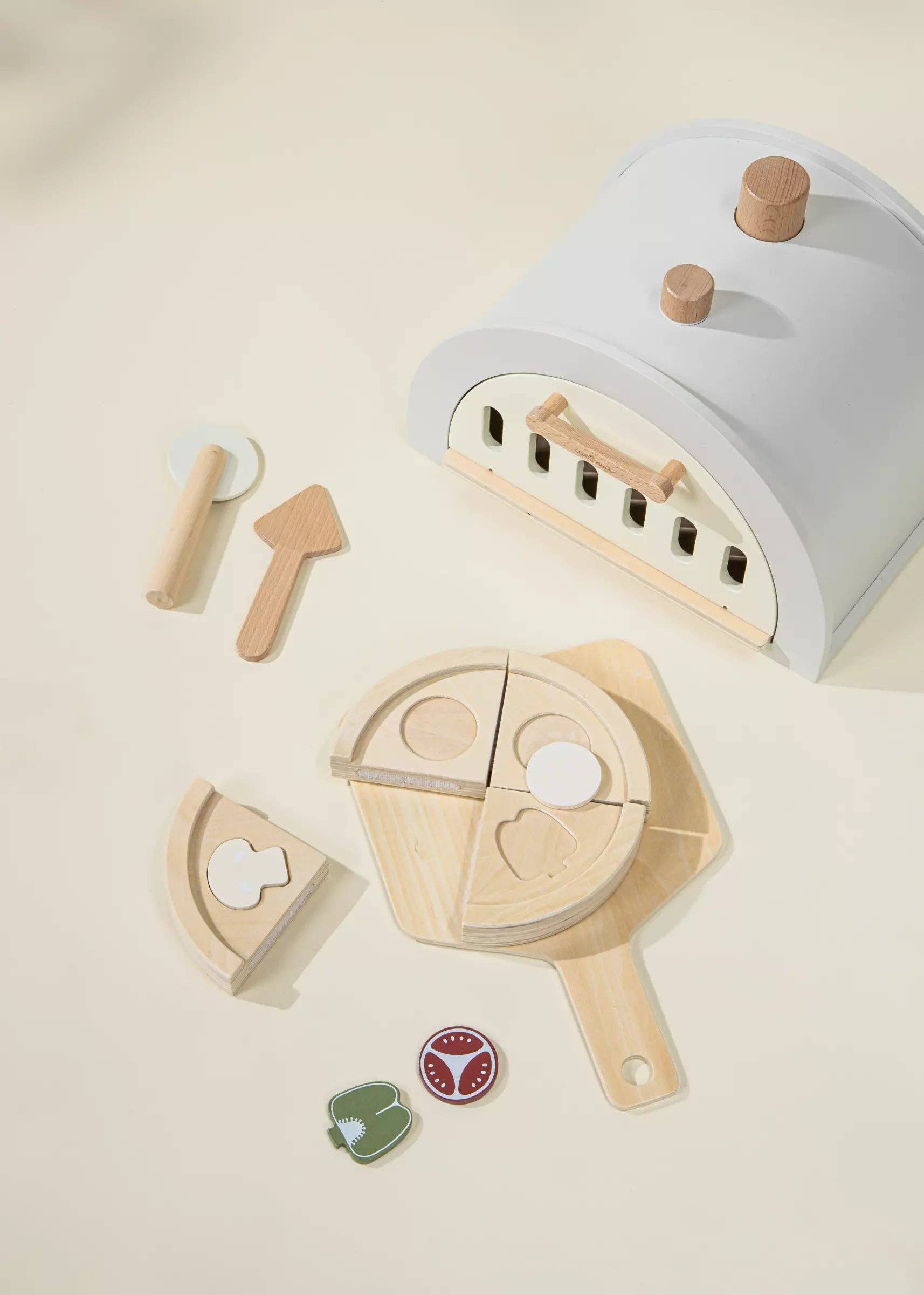 Wooden Pizza Oven Playset for kids with oven, 4 pizza slices, tomato, onion, mushroom, green pepper, pizza peel, cutter, and pie server. Ideal for pretend play, sparking creativity, and hosting pizza parties where little chefs can bake and share their creations.