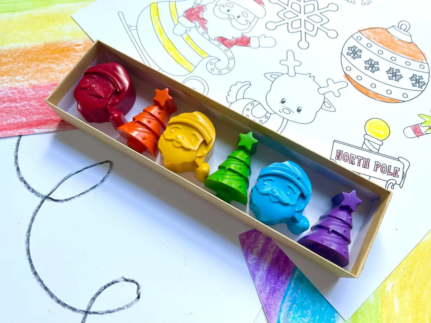 Santa Crayon Gift Set featuring 100% non-toxic holiday-themed crayons in festive shapes for stocking stuffers and party favors, packaged in a gift box.