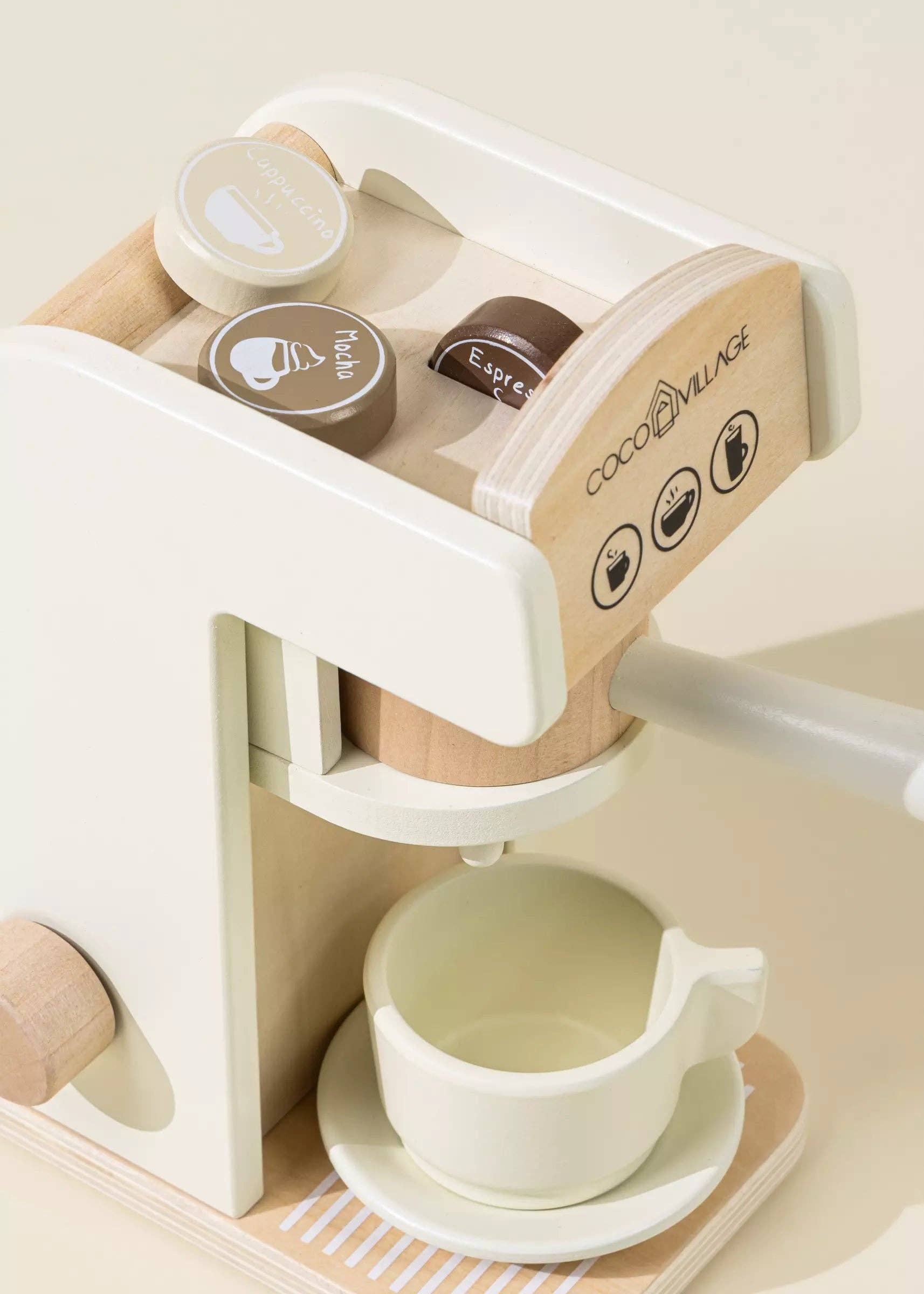 Wooden Coffee Maker Playset for kids with 4 coffee pods, cup, plate, spoon, cup holder, and 2 to-go cups. Perfect for imaginative play, allowing children to role-play as baristas, creating cappuccinos, lattes, and more. Encourages creativity and motor skills development.