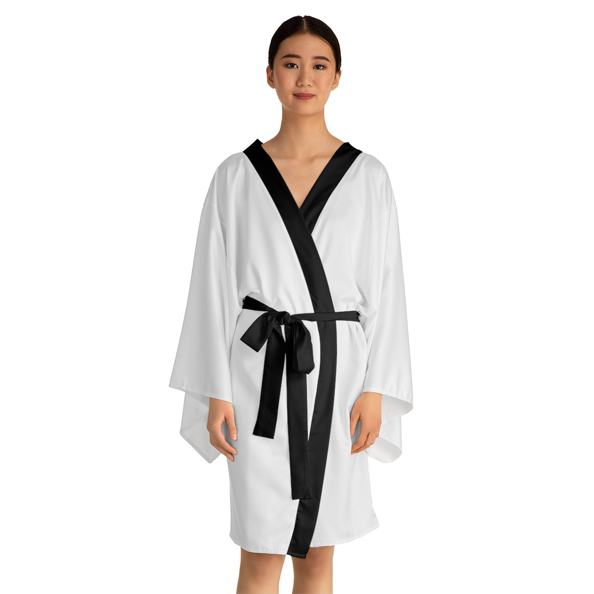 Beautiful mid-length kimono robe made from 100% polyester, offering a smooth and silky feel. Perfect for bridesmaids or girls looking for cozy comfort.