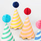 Bright striped party hats with honeycomb balls, gold foil details, and elastic cord, pack of 8."