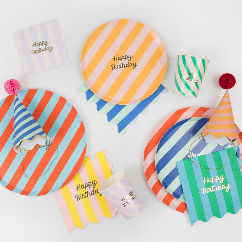 Colorful striped gift bags with honeycomb ball tags and gold metallic ties, pack of 8.